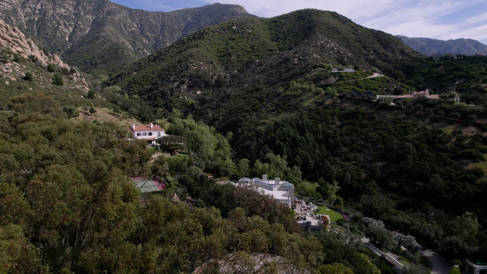 Hills above the city in afternoon sun.