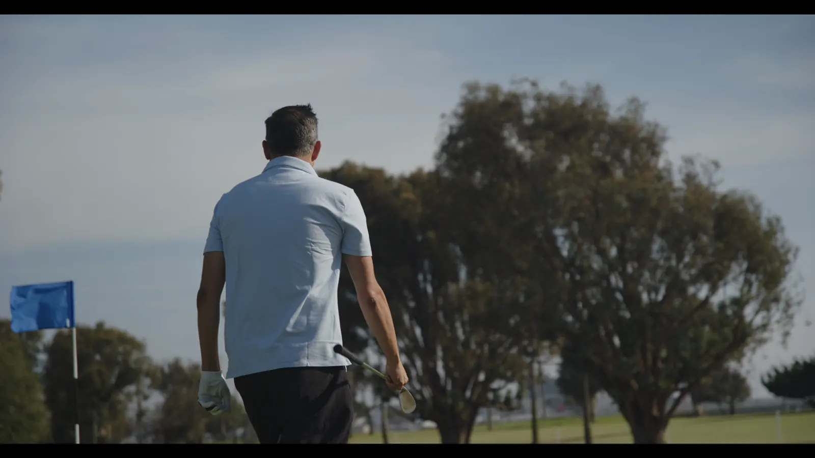 Walking the fairway in a HyperNatural polo.