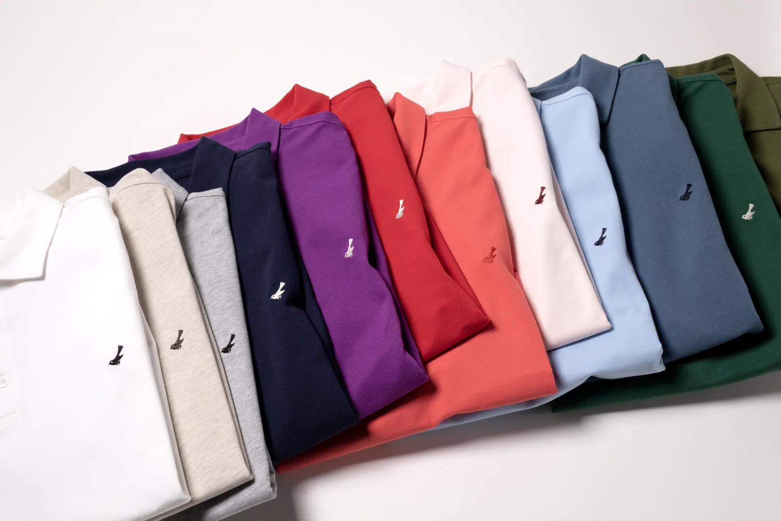 A stack of folded polos in colour.
